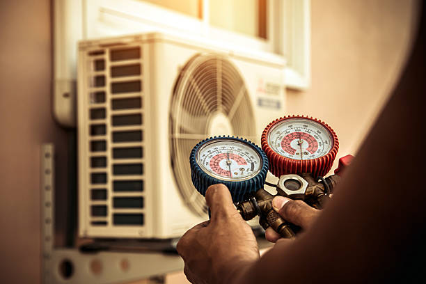Professional Air Conditioning Service technician working in Dousman, WI